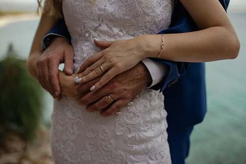 holding hands man wrapping hand around woman's waist fingernail